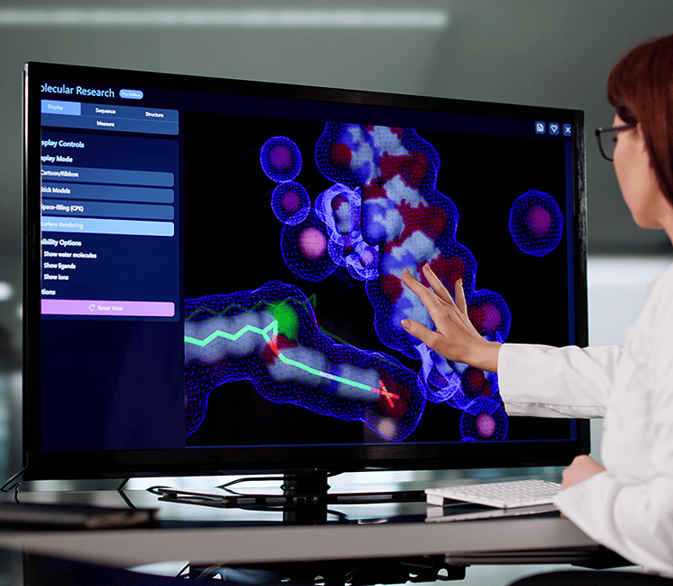 Scientist at a computer screen displaying a 3D molecule
