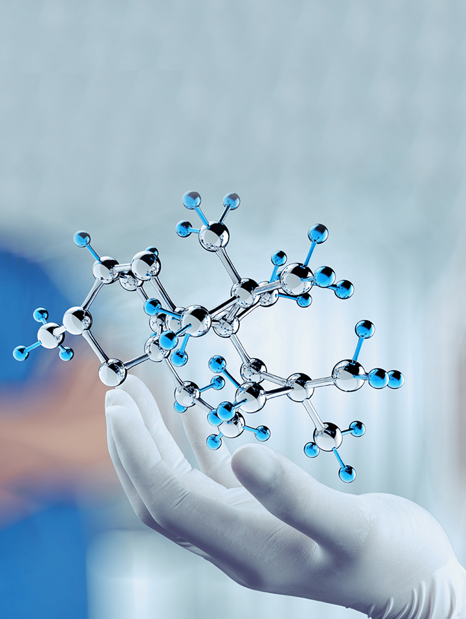 Gloved hand holding a molecule